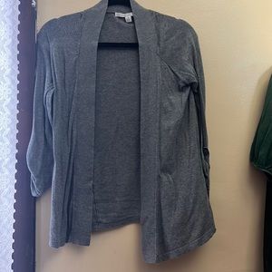 This is a grey cardigan.